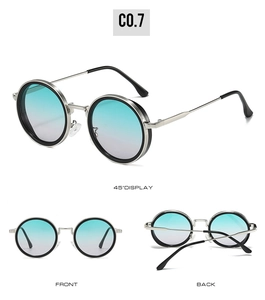 Detail view of round vintage sunglasses with gradient lenses and silver metal temples