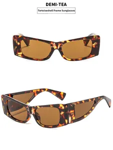 Vue détaillée des lunettes de soleil demi-thé avec monture géométrique en aile de papillon