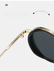 Macro shot of durable gold metal hinges and black frame with parallel wave details