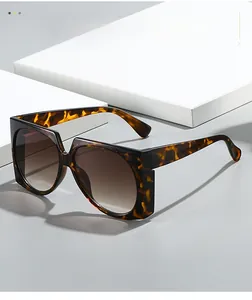 Close-up of tortoise shell square oversized sunglasses with brown gradient lenses