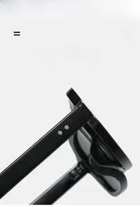 Macro detail of glossy black square sunglasses frame with metal rivet hinges