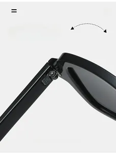 Detail shot of durable metal hinge on black square frame sunglasses for premium quality