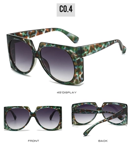 Detail view of square oversized sunglasses with camouflage color block frames and gradient lenses
