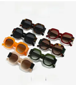 Detailed view of various colorful polygonal sunglasses with thick octagonal frames