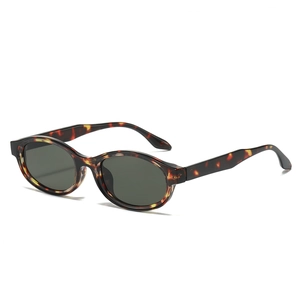 Stylish tortoise shell oval sunglasses with dark lenses from a 45-degree angle view