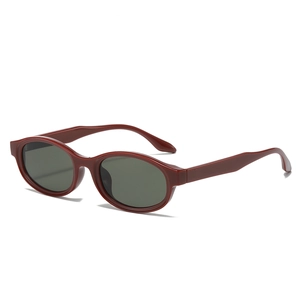 Retro deep red oval sunglasses with black lenses shown from a 45-degree angle