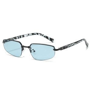 Modern fashion sunglasses with blue lenses and marble patterned temples on white background