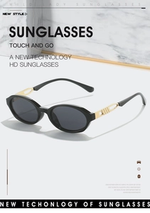 Close-up of women's oval sunglasses with hollow golden metal temples and HD lenses