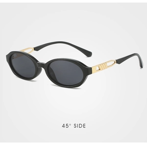 Detail view of retro oval sunglasses with golden hollow-out metal temples and black frames