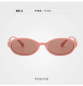 Front view of pink oval sunglasses with translucent lenses and gold metal details