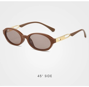 Detail showing vintage oval red sunglasses with golden hollow temple design and 45° side view