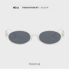 Front view of oval transparent frame sunglasses with dark lenses and minimalist design