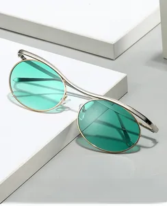 Detail of round metal glasses frame with green protective lenses and sleek modern design