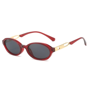 Retro oval sunglasses with red translucent frames and gold镂空 metal temples