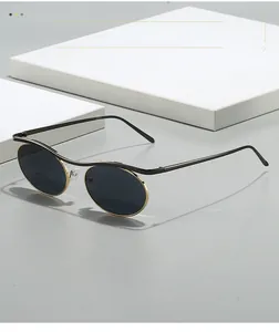 Steampunk sunglasses with round metal frames and a double bridge on a minimalist background