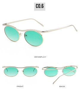 Detail view of gothic steampunk round sunglasses with silver metal frame and green lenses