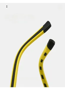 Macro detail of curved two-tone sunglasses legs designed for arc comfortable wear