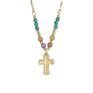 Close-up of golden cross pendant with multi-colored glass beads on a stainless steel chain