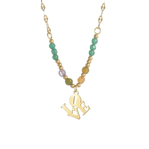 Close-up of golden LOVE pendant necklace with colorful faceted beads and metallic chain