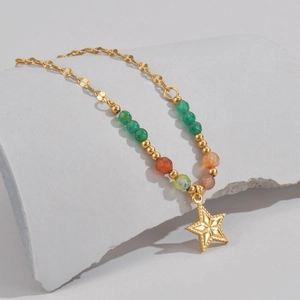 Gold star pendant necklace with colorful beads and vintage engraved texture on stone