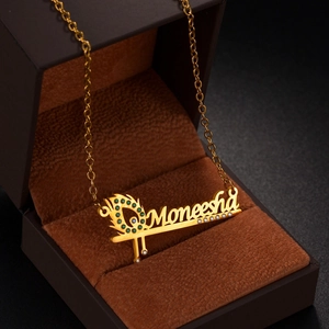 Custom gold name necklace Moneesha with peacock feather and sparkling zircons