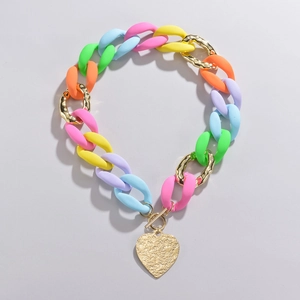 Colorful acrylic link necklace with a golden hammered heart pendant and OT toggle clasp