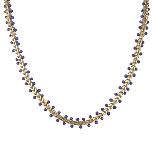 Bohemian gold wheat chain necklace with dark blue faceted beads in a U-shaped display