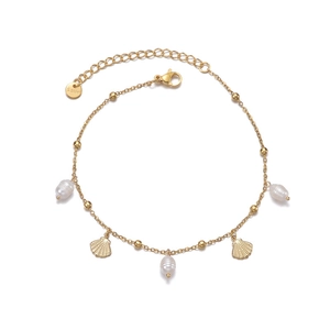 Gold stainless steel anklet with baroque pearls and shell pendants on white background