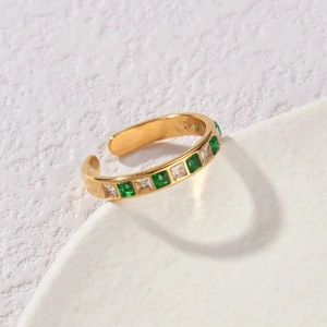 Gold adjustable ring with alternating green square gems and white cubic zirconia