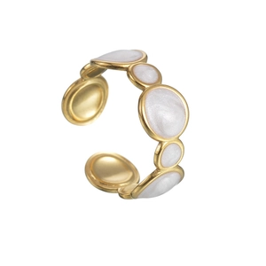 Gold adjustable ring with minimalist white enamel insets on a clean white background