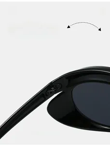 Macro shot of durable metal hinges on oversized cat-eye sunglasses with polished black frames