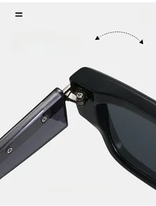 Detail of durable silver metal hinges on thick black square frame sunglasses
