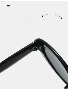 Close-up of durable metal hinge on black oval cat eye sunglasses with a polished finish