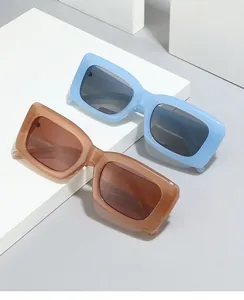 Detail view of stylish square eyewear frames in light blue and matte tan colors