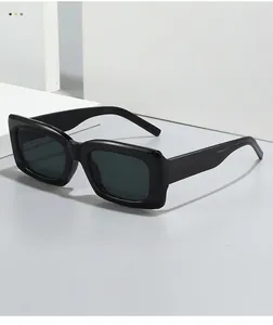 Detail of square black glossy sunglasses frames with high-quality dark grey lenses