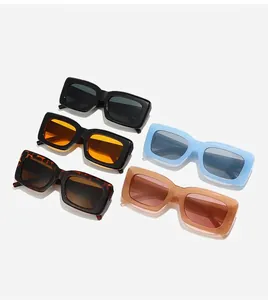 Flat lay of vintage square sunglasses in black, tortoiseshell, orange, and blue colors