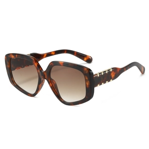 Chic tortoise shell oversized sunglasses with gold metal buckle detail and gradient lenses