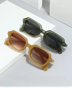 Detail shot of vintage square sunglasses with metal rivet hinges on white blocks