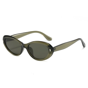 Vintage oval cat eye sunglasses in translucent olive green frame with dark gray lenses