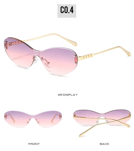 Detail view of pink gradient cat-eye sunglasses with square link gold metal temples