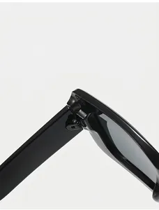Detail of durable high-gloss metal hinge and sturdy screw structure on square sunglasses