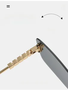 Macro view of durable gold chain-style hinges and grey rimless square lenses detail