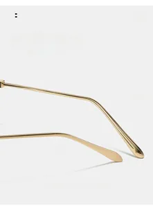 Detail view of golden curved metal temple with teardrop end for cat-eye sunglasses