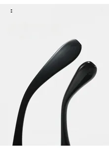 Detail of curved ergonomic temple tips in glossy black for comfortable eyewear fit