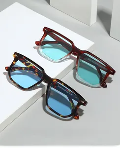Detail of square vintage sunglasses with blue lenses and ZN3912 model code on the temple