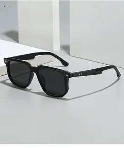Close-up of black square frame sunglasses featuring silver metal rivet decorations on the side