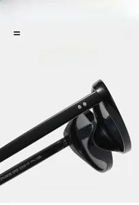 Detail of black cat-eye sunglass frame with silver rivets and ZN3936 model marking