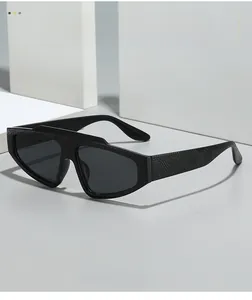 Close-up of textured matte black oversized sunglasses frame with embossed grid patterns