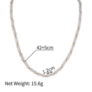Bamboo tube bead necklace with gold spacers and white faux jade resin elements