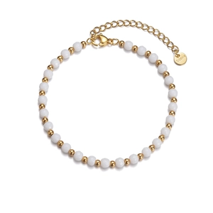 Detail of beaded bracelet with white faceted beads and S.Steel gold logo tag